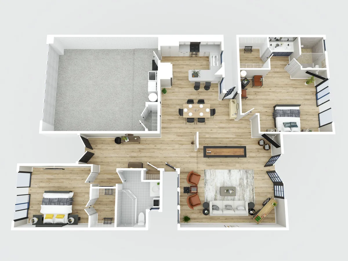 A wide view of the main living area, with a comfortable seating area, dining table, kitchen island, and a glimpse of a bedroom. The open-concept layout suggests spaces for both work and downtime, with plenty of natural light and room to move between relaxation and productivity.